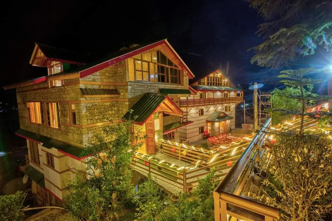 Sunset Resort building exterior at night, Manali